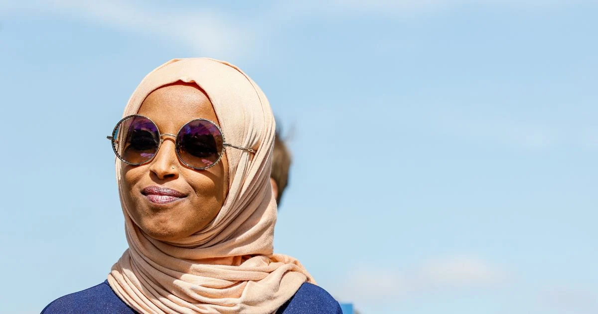 Representative Ilhan Omar Faces Federal Immigration Fraud Investigation Amidst Home Raid and Public Fundraising Appeal.